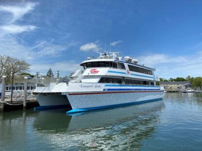 A ferry boat docked in a body of water.